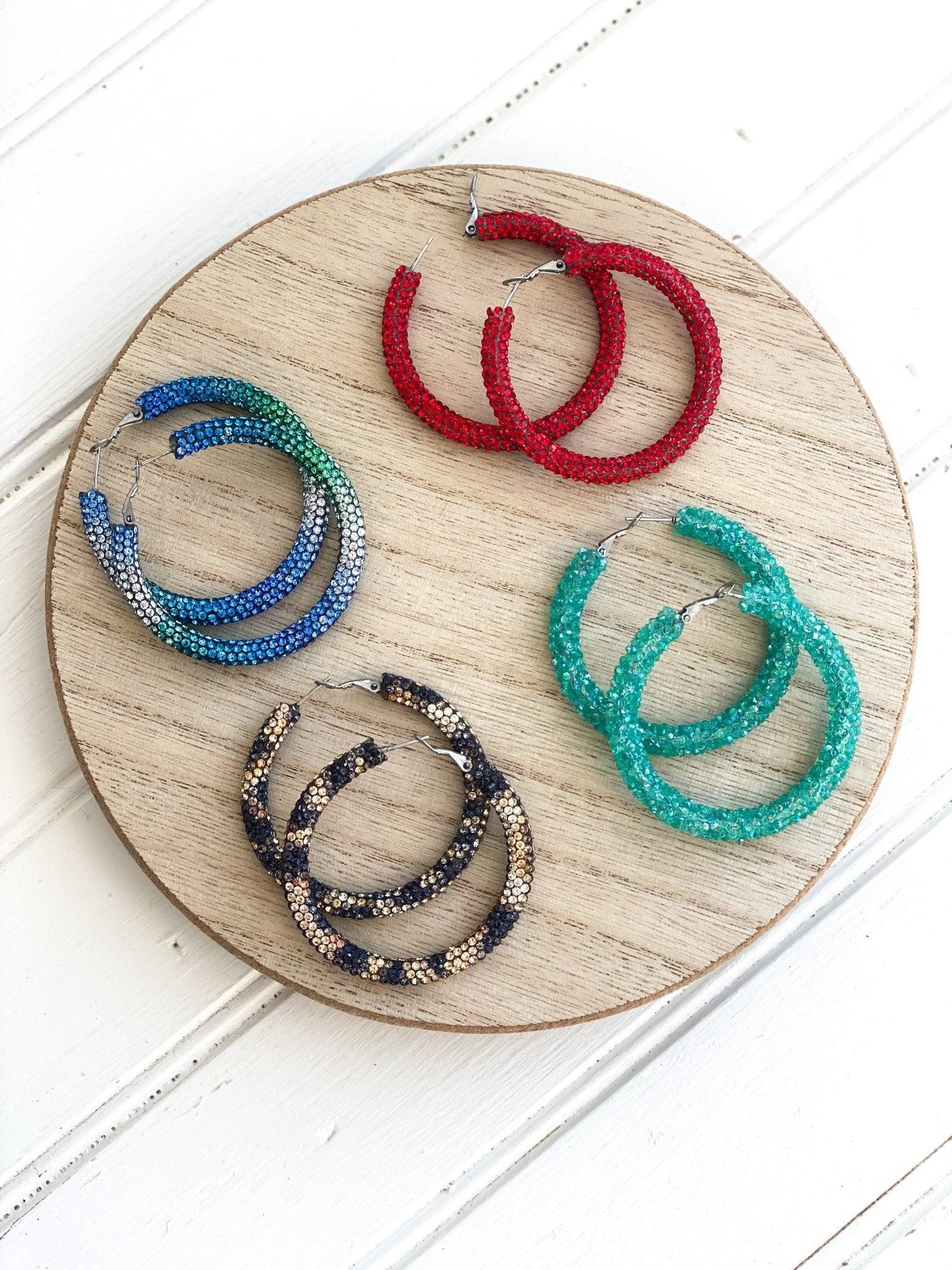 Four Pair of Handmade Sparkly Leverback Hoop Earrings on Wooden Display Circle