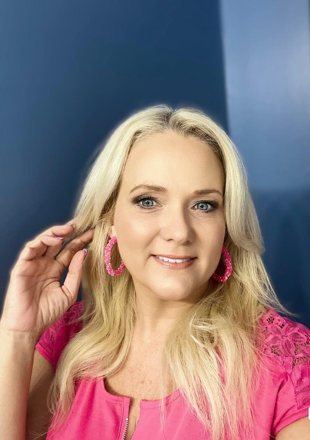 Blonde Model in Pink Shirt Wearing Big, Handmade Sparkly Leverback Hoops in Pink