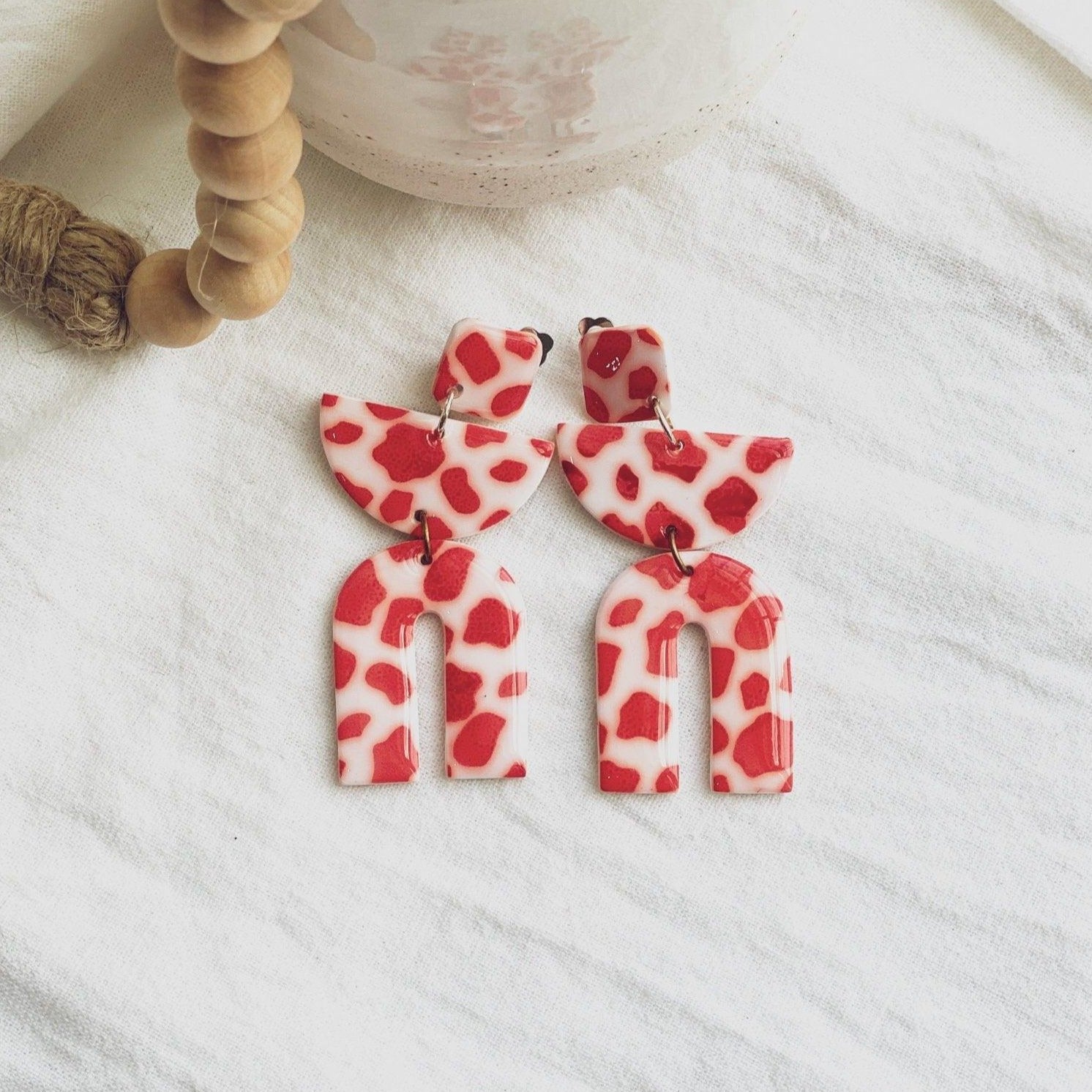 Cow Print Clip On Earrings – Triple Dangle Fun in Classic Black & Bold Red with Silicone Comfort Covers - Harbor to Gulf Co.