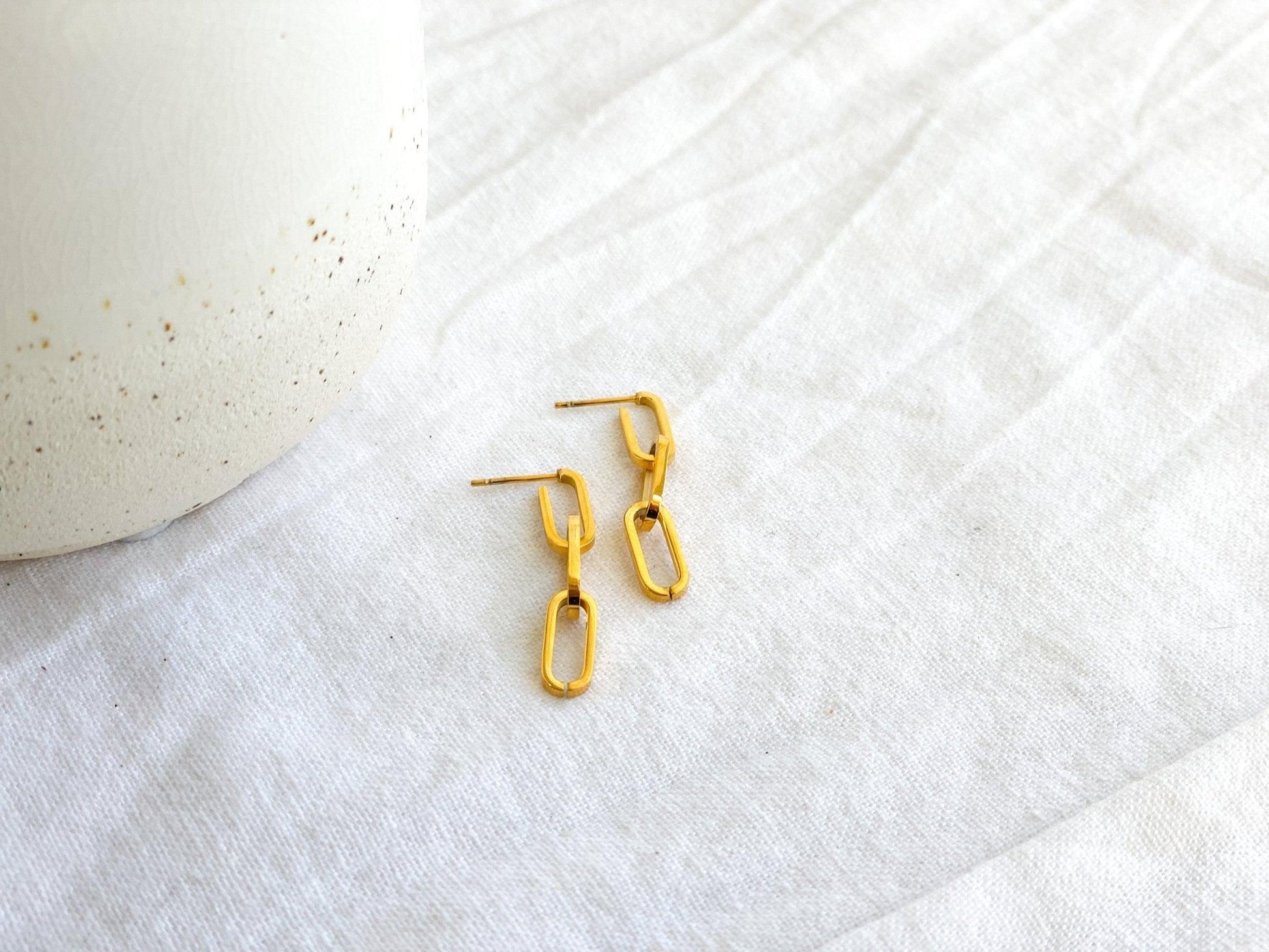 Small Gold Paperclip Chain Dangle Earrings with Surgical Steel Posts on White Linen Cloth