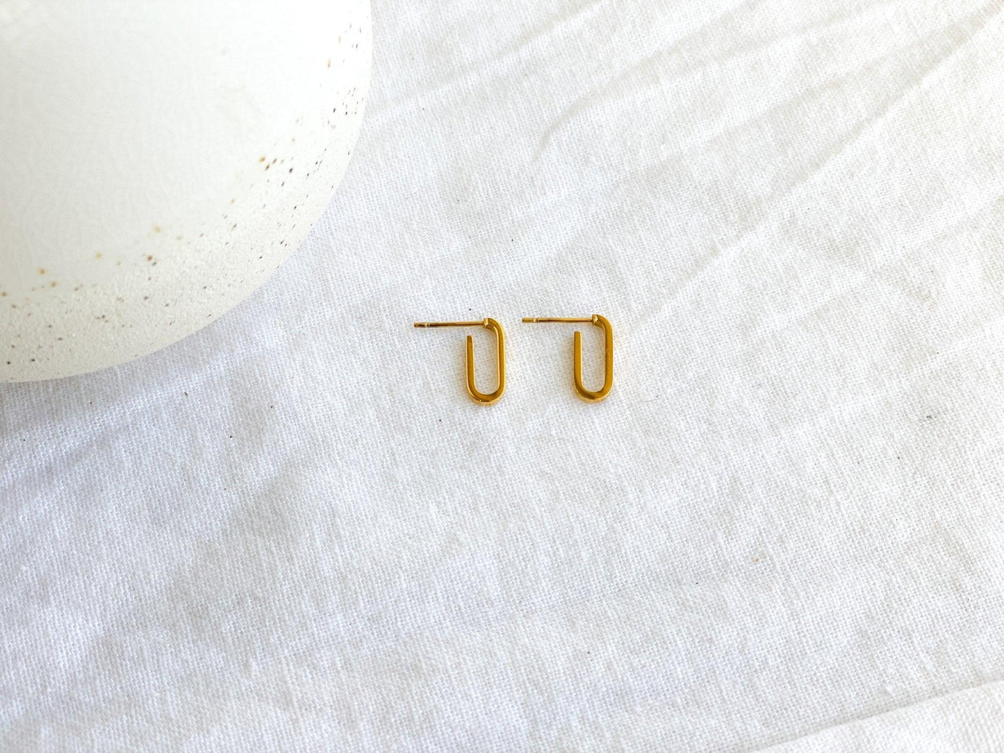 Small Gold Paperclip Chain Dangle Earrings with Surgical Steel Posts on White Linen Cloth