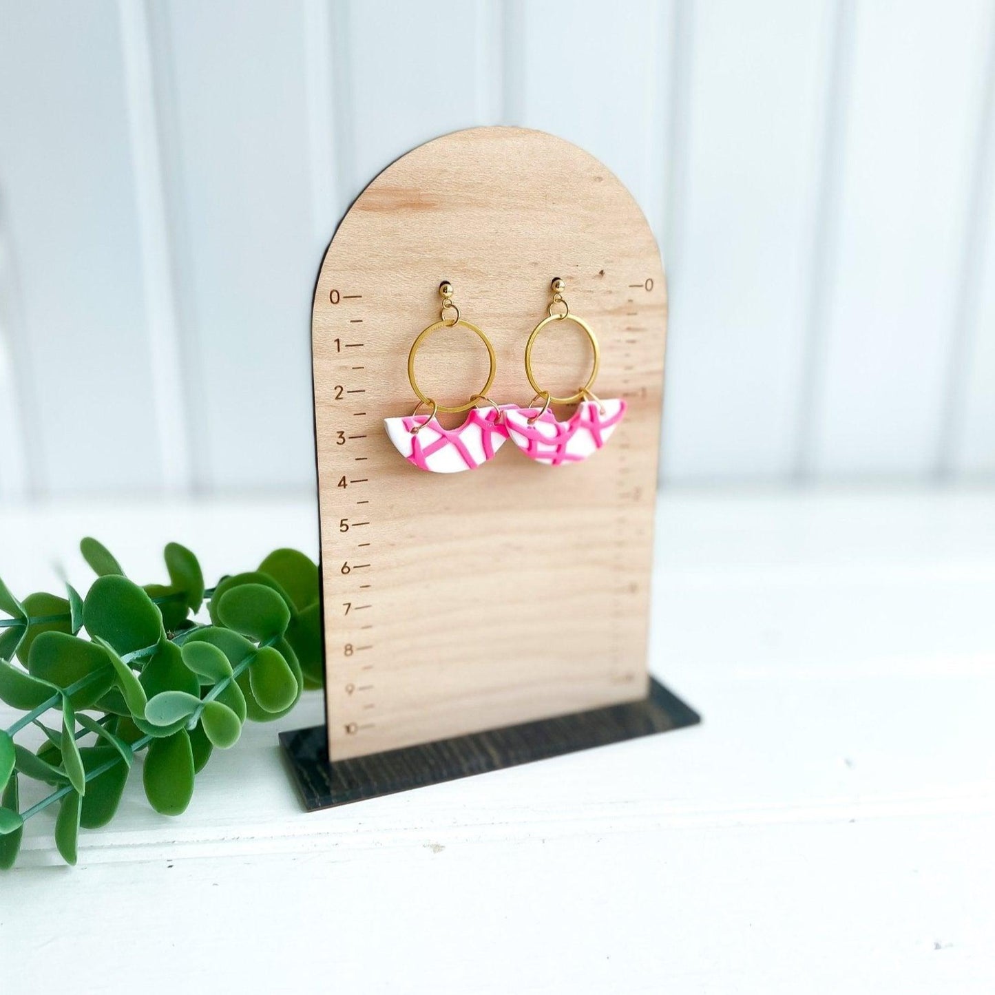 Handmade Pink and White Abstract Earrings with Surgical Steel Posts on Wood Earring Measurement Stand