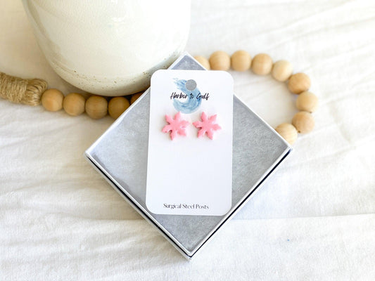 Pink Snowflake Stud Earrings with Surgical Steel Posts on earring card in white gift box