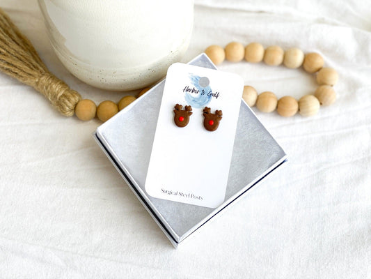 Cute handmade Rudolph Stud Earrings made from polymer clay and surgical steel posts on earring card in white gift box