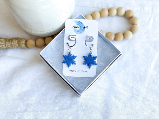 Handmade Sparkly Blue Snowflake Earrings on Silver Surgical Steel Huggie Earrings on Earring Card in White Gift Box