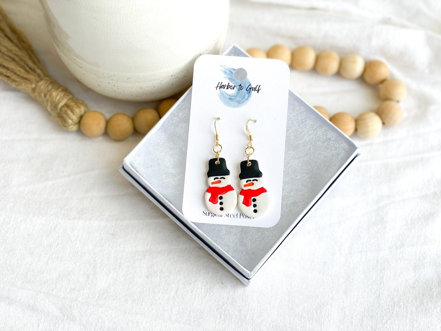 Cute Handmade Clay Snowman Earrings on Gold Ear Wires made from Surgical Steel on earring card in a white gift box